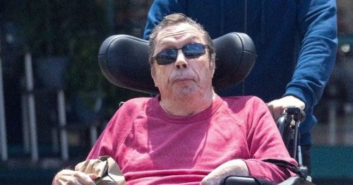 Tim Curry seen on rare outing with carer 13 years after suffering a stroke