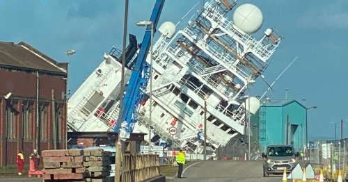 Billionaire's massive ship topples over with people on board as 999 crews rush to scene