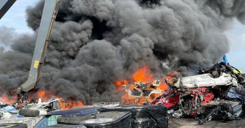 Massive blaze with smoke seen for miles across town with 100 cars on fire