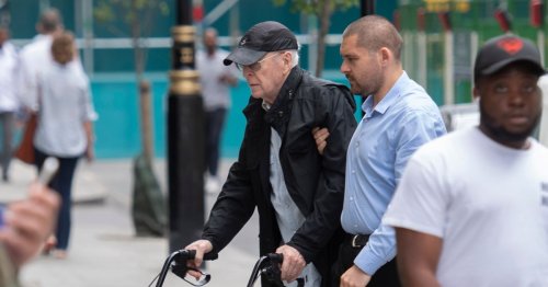 Sir Michael Caine, 89, uses walking frame on day out in London with his wife Shakira
