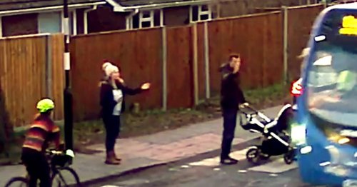 Horrifying moment dad and baby in pram narrowly avoid being run down by bus on crossing