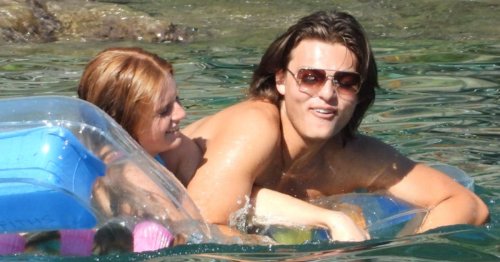 Damian Hurley gets cosy on a lilo with a mystery red head after leaving drama school