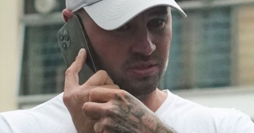 Katie Price's fiancé Carl Woods spotted on phone after she denied split rumours