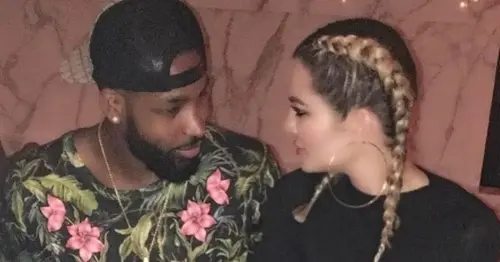 Tristan Thompson leaves club flanked by pretty brunettes - as Khloe Kardashian posts cryptic messages about moving on