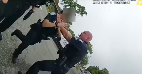 Police officer chokes female colleague by neck during arrest in vile footage