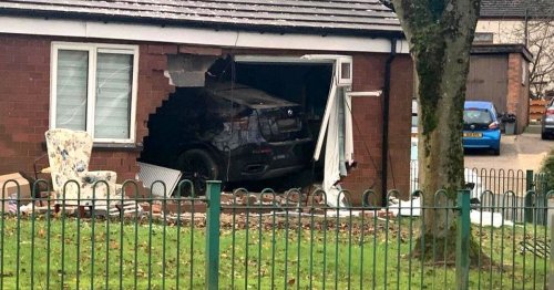 Woman, 92, rushed to hospital after car smashes through wall into her bungalow