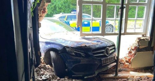 Car smashes halfway through the inside of village pub and completely destroys wall