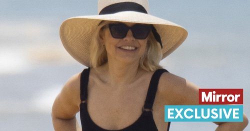 Beaming Holly Willoughby enjoys beach pints on holiday away from Phil Schofield drama