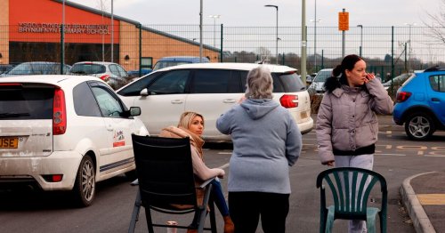 Residents use garden chairs as barricade in school run parking feud with parents