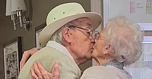 Heartwarming moment elderly couple kiss as they are reunited after months apart
