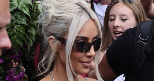 Kim and Khloe Kardashian arrive back in LA after sister's lavish wedding to Travis Barker
