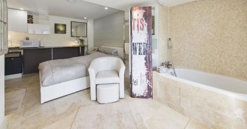 London flat mocked for £1,150 rent with the bath in centre of living room