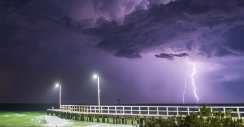 Stunning images capture bizarre and unique storm as sky lights up purple
