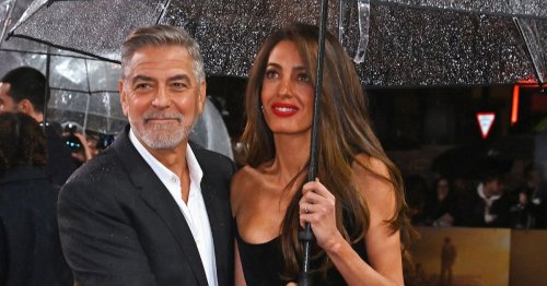 George Clooney lovingly holds wife Amal and protects her at new movie premiere