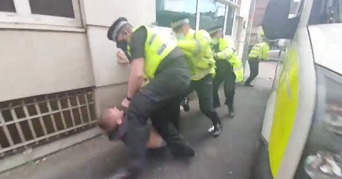 Police officer appears to punch Man Utd fan on ground in eyewitness footage