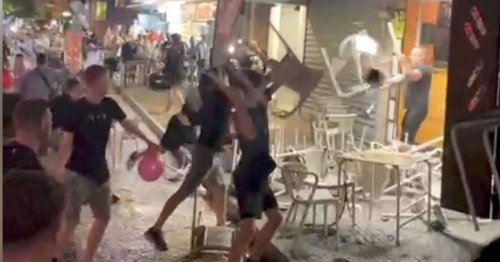 Tables and chairs go flying as 20-strong Brit mob clashes with baffled bar staff