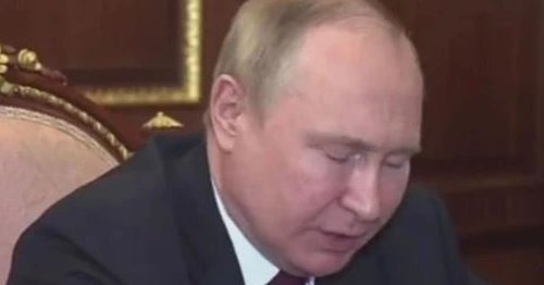Puffy-faced Vladimir Putin struggles to stay awake as he looks exhausted during meeting
