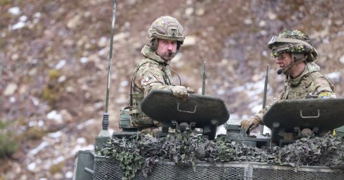 Prince William rides in tank just 90 miles away from Putin's Russia as he meets troops