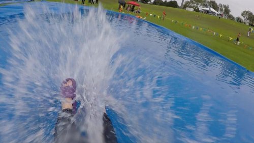 What it’s like to ride down a 100-foot-long slip n’ slide