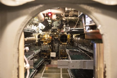 Peer out the periscope, sleep next to torpedoes on a World War II submarine