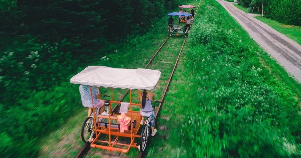 You Can Ride Bike Trains Along The Shore Of A Quebec Lake This Summer