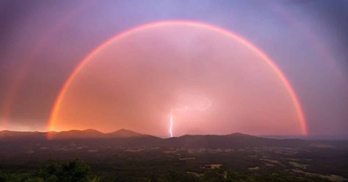 Photographer Captures Once-in-a-Lifetime Shot of a Lightning Bolt Framed by a Double Rainbow