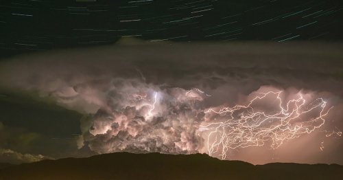 Amazing Photo Captures Intense Lightning Storm With Star Trails Swirling Above It