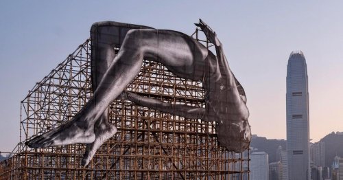 JR Unveils Giant Installation of Athlete Jumping Over Hong Kong’s Bamboo Scaffolding