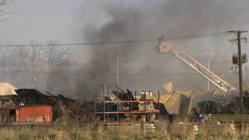Multiple explosions heard, firefighter hurt in massive fire at Joliet building