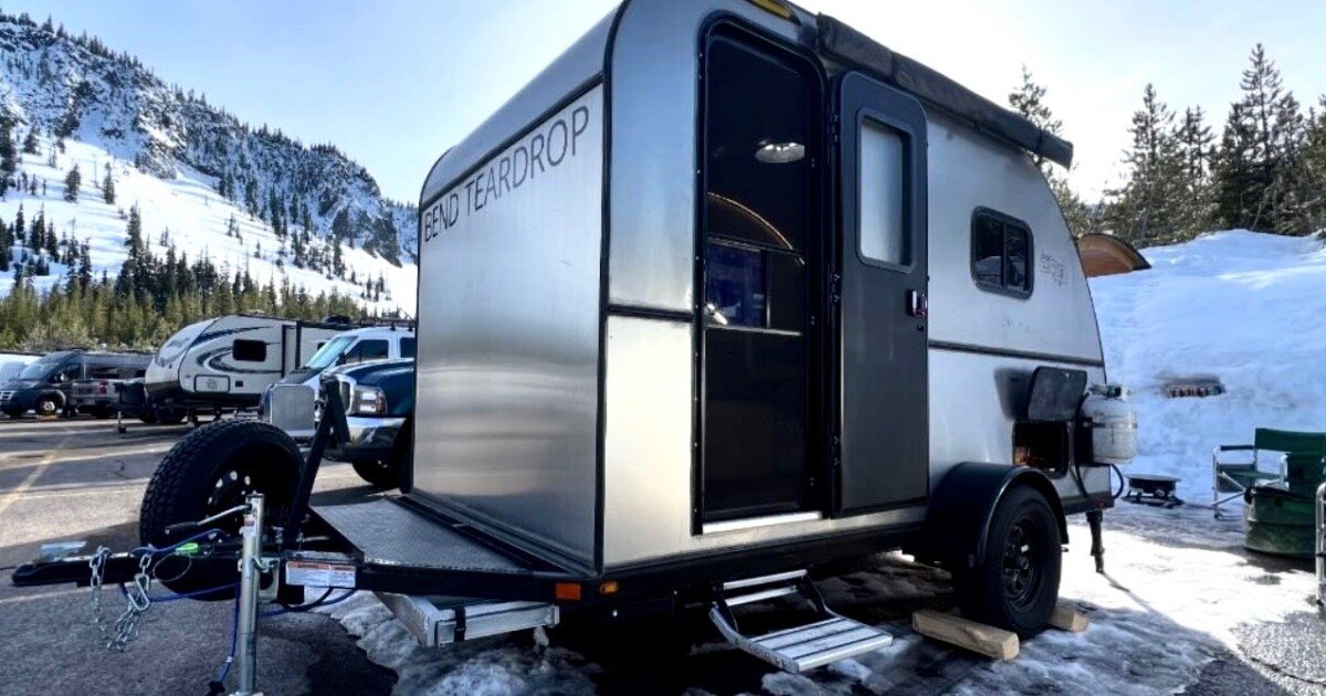 High-rise teardrop trailer makes standing-height base camp for four