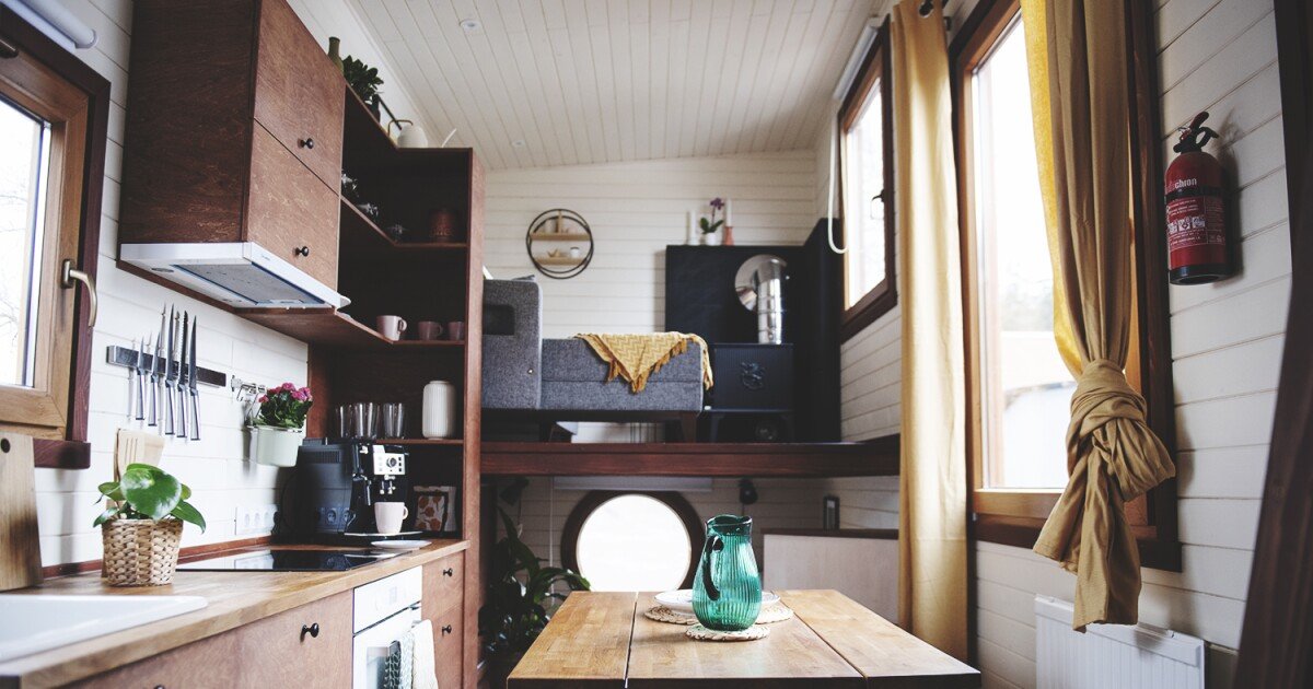 Elise tiny house lifts the living room to fit family of three
