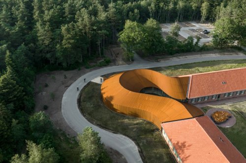 Curving Danish refugee museum tastefully merges old with new