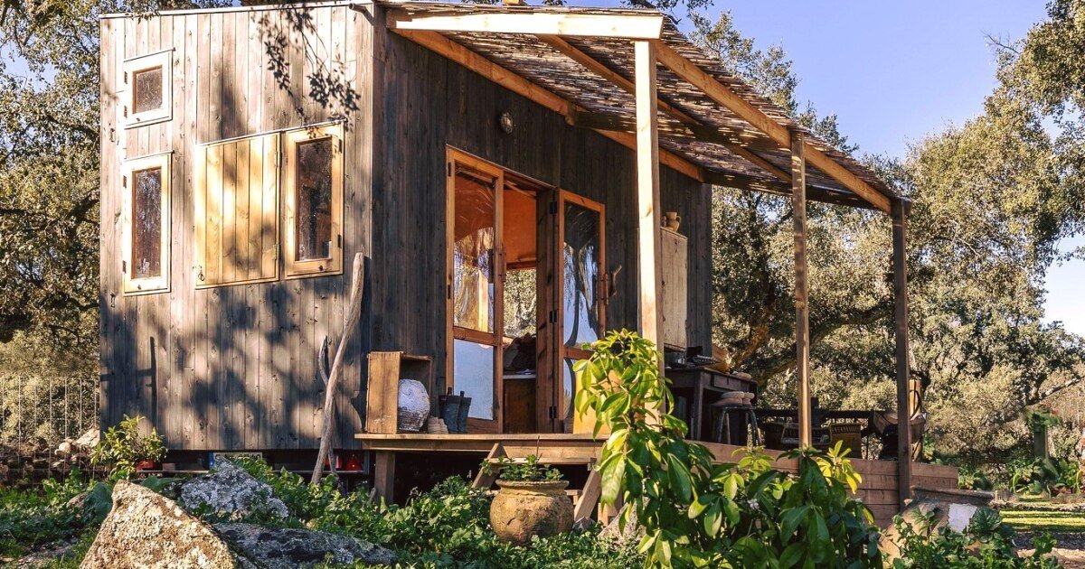 Rustic timber tiny house squeezes two people into 12 sq m