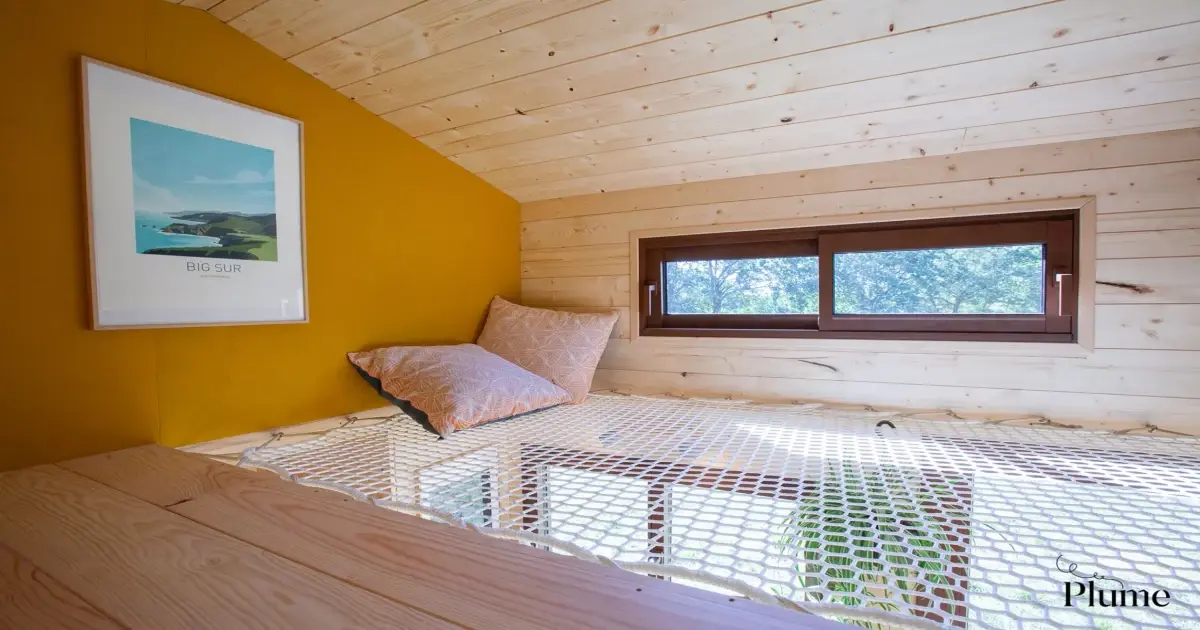 Compact tiny house's clever layout nets some extra space upstairs