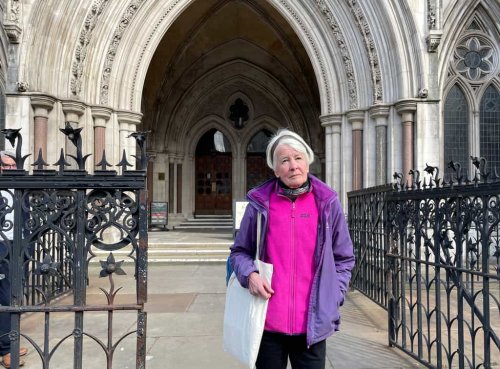 Protester committed contempt by holding sign for jurors to see, High Court told
