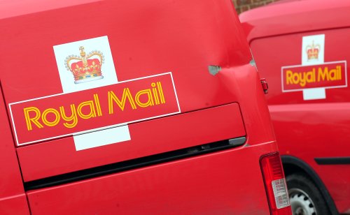 Royal Mail workers back strike action in row over terms and conditions