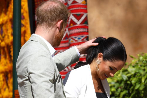 Prince Harry Fixing Meghan's Hair in Resurfaced Video Goes Viral: 'So Cute'