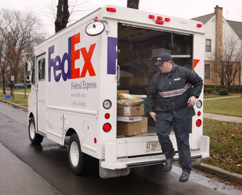 FedEx driver mauled by dogs has arm amputated following attack