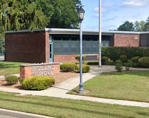 Security guard accidentally fired gun in N.J. school bathroom, officials say