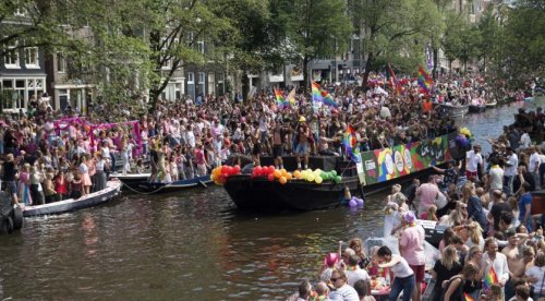 Despite rain, 26th Canal Parade in Amsterdam is in full swing