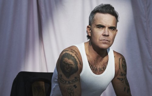 Robbie Williams announces new album ‘BRITPOP’, shares blistering single with Black Sabbath’s Tony Iommi