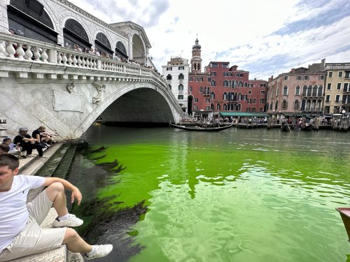 A fluorescent green Venice canal is beguiling residents. Police are on the case