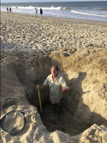 A man's death shows the dangers of digging deep holes on the beach