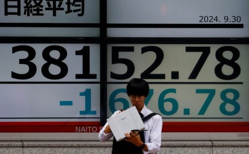 Most Asian markets drop, dollar gains as Trump fires tariff warning