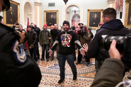 Capitol cop led DC rioters from open Senate chamber door before it was locked