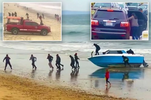 Dozens of migrants rush past shocked California beachgoers after speedboat suddenly washes ashore in wild video