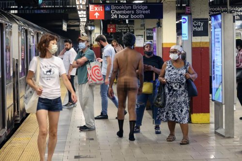 New Yorkers barely flinch as a naked man strolls through subway station