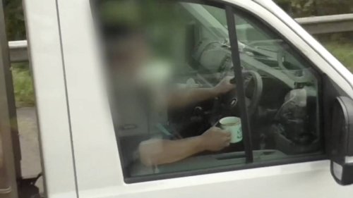 Watch: Man drinks tea while driving - and has a dashboard cupholder