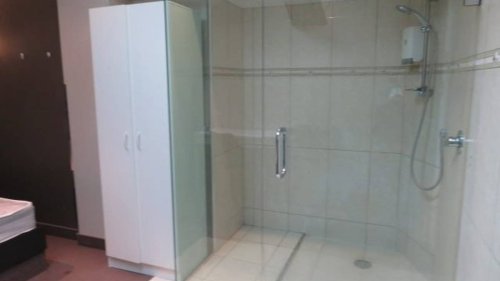Single room in former Wellington brothel up for rent $320, shower next to bed