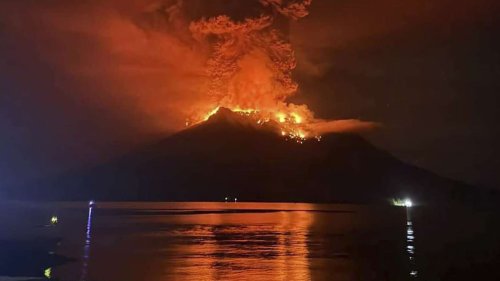 Indonesians leave homes near erupting Mount Ruang volcano and airport closes due to ash danger